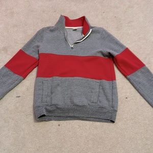 Medium red and grey jacket.